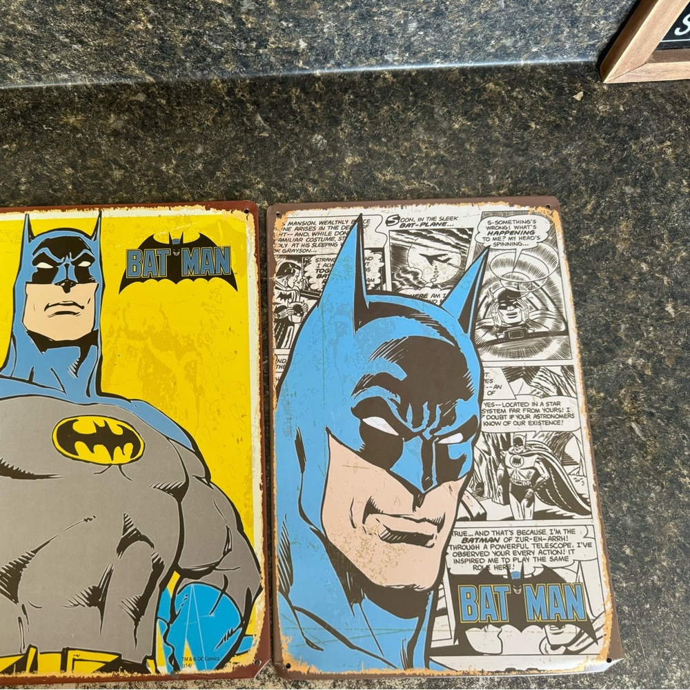 Two Batman tin signs